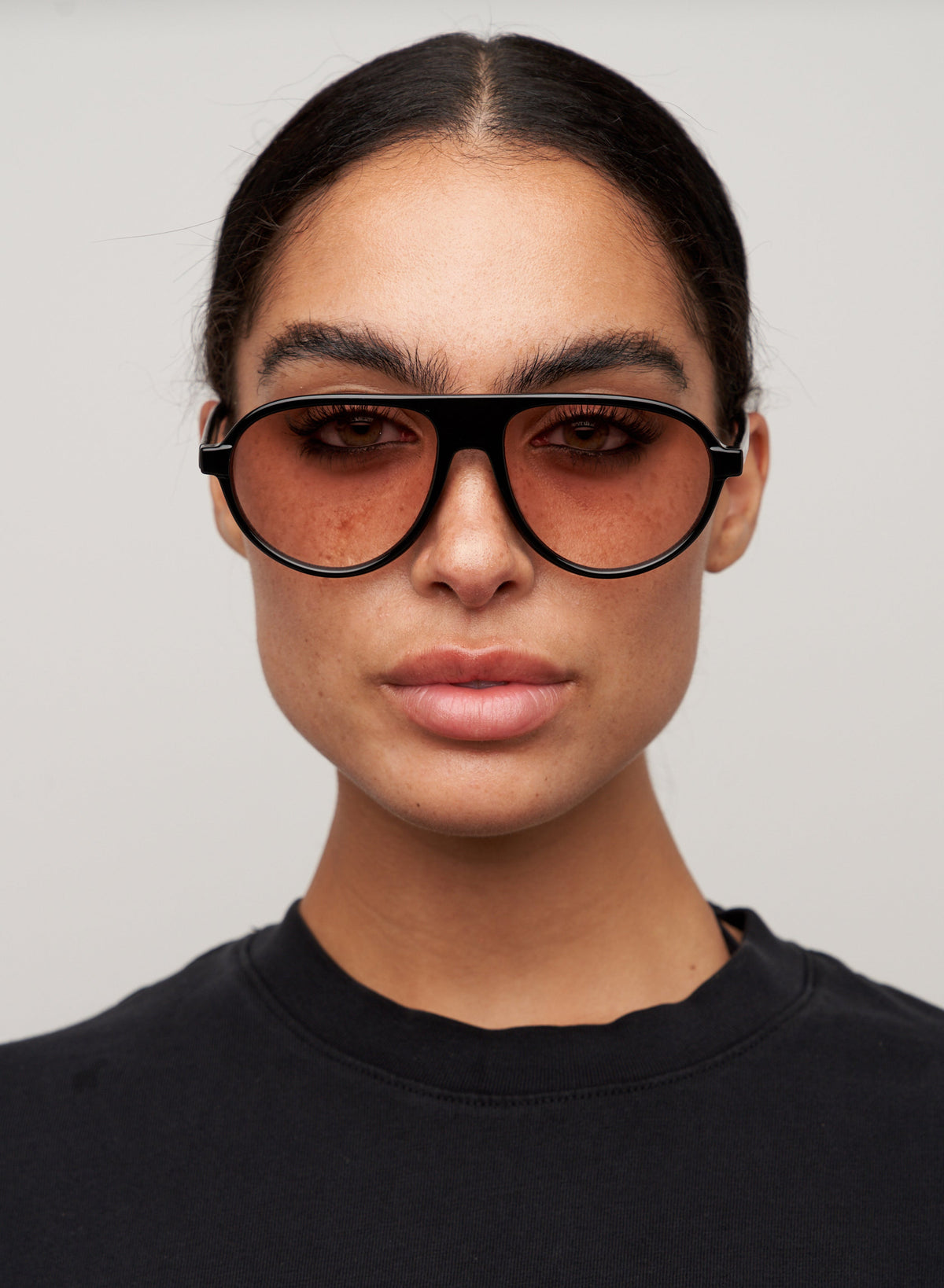 Model wearing Iggy black sunglasses