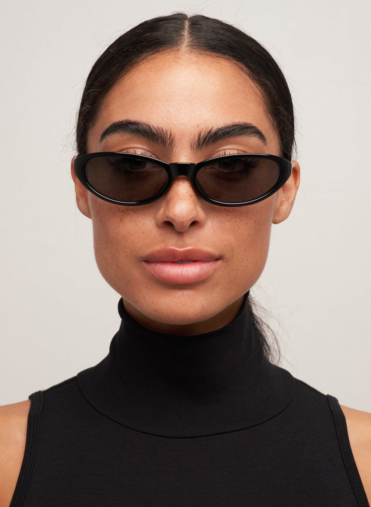 Model wearing Kenny black cat-eye sunglasses