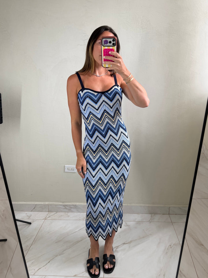 ISSUE 92 Ziggy Dress, a knit midi dress with a blue, white, and black chevron pattern. Features spaghetti straps and a scalloped hem.