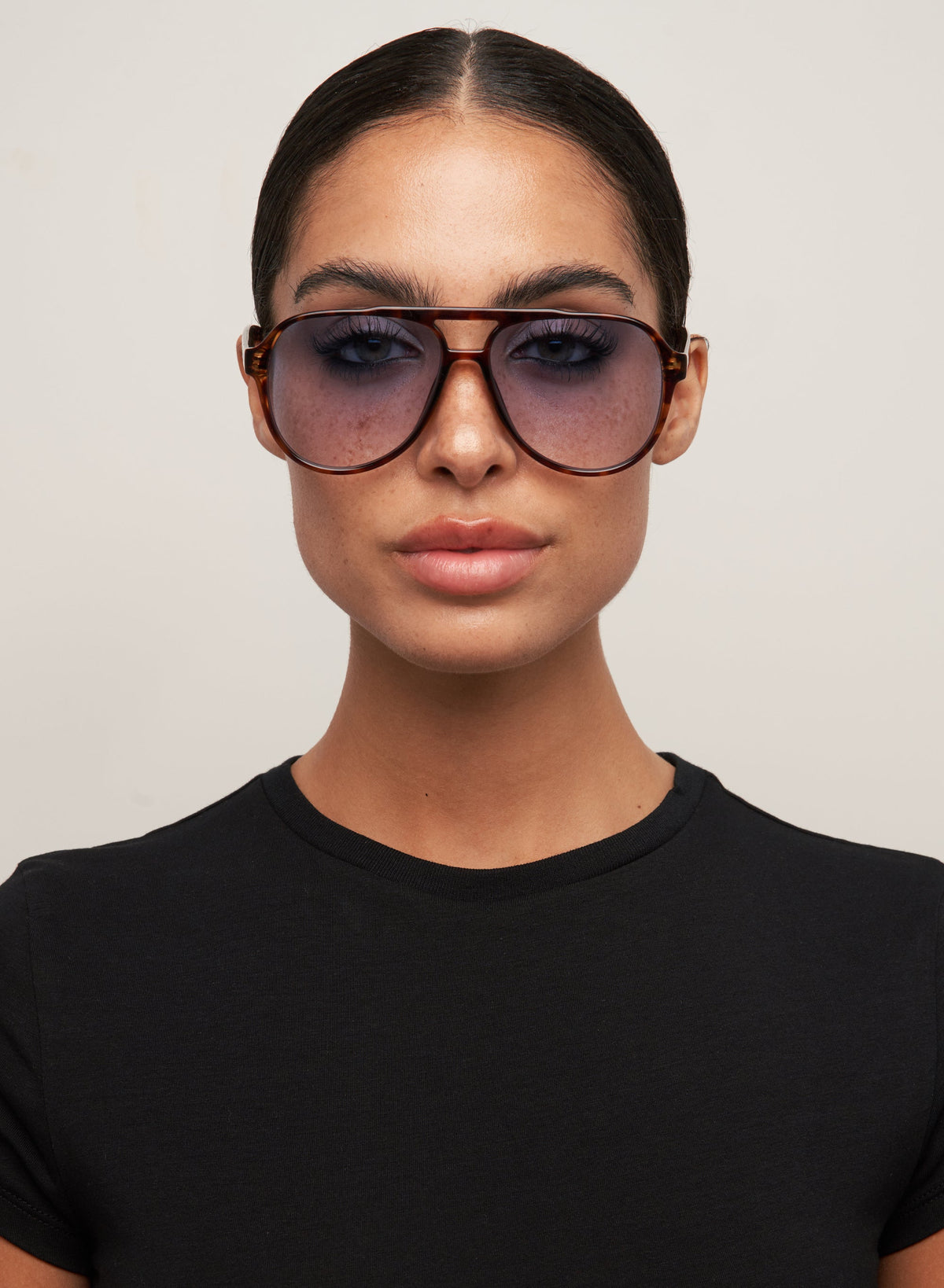Model wearing Stevie tortoiseshell aviator sunglasses